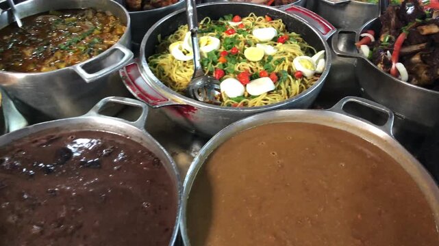 Minas Gerais cuisine made on a wood stove with rice, beans, feijoada, pork, pasta, sausage and chicken, Self-service buffet with a variety of products