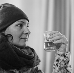 Winter in Batoumi, a woman is having black tea. Georgia - February 2025.