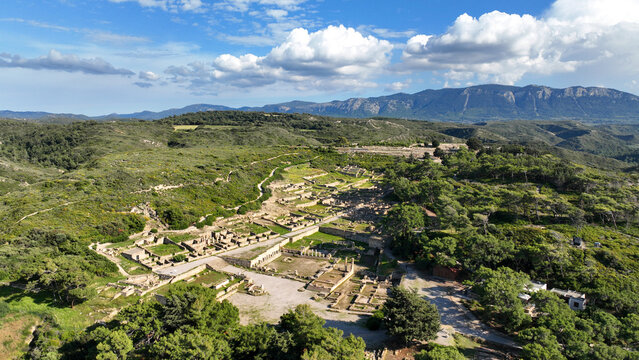 Aerial drone photo of iconic archaeological site of former hillside city of Kameiros, overlooked by the columns of an acropolis dedicated to Athena, Rhodes island, Dodecanese, Greece