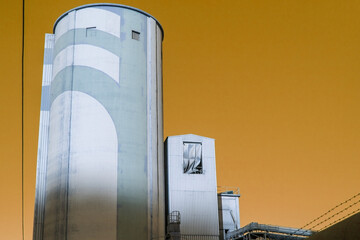 Cement Plant Towers in Harsh Urban Landscape