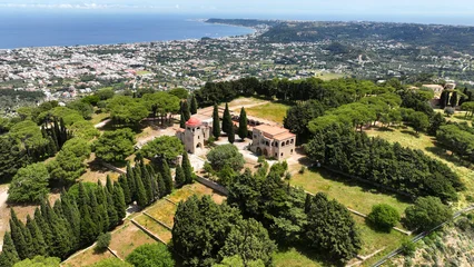Fototapeten Mediterranes Europa Aerial drone photo of iconic Monastery and giant Cross of Filerimos, built uphill in ruins of ancient village of Ialysos, Rhodes island, Dodecanese, Greece  © aerial-drone