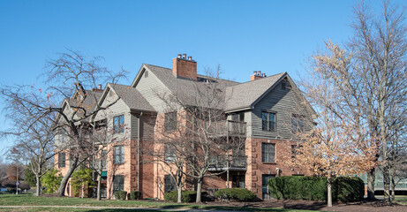 Upscale, Red Brick and Taupe Siding Apartment Complex