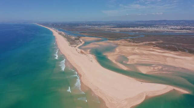 mapping tide flows on coastal sandbanks, marine scientist observes wave formations on curving beaches, aerial photography uncovers intricate water pathways along winding coastlines
