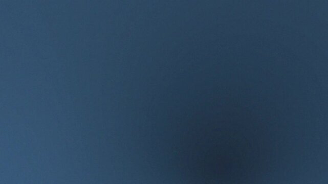 A simple background featuring a solid dark blue color with subtle gradient variations across frame