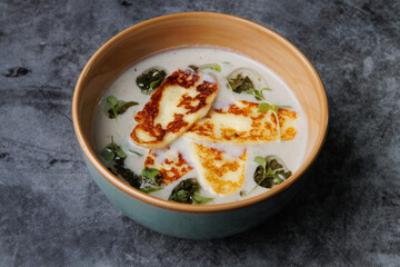 Creamy Cheese Soup, Garnished with Herbs and Melted Cheese