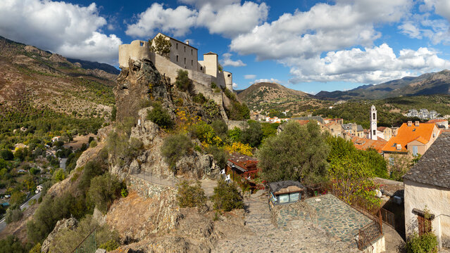 famous restored citadel and historical city of corte in corsica france on rock wide panorama. corse culture concept