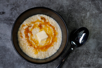 Creamy Porridge Bowl With Butter And Honey For Cozy, Warm Breakfast Moments At Home Everyday