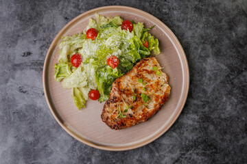 Grilled Chicken and Fresh Romaine Salad on Beige Plate with Cherry Tomatoes - Healthy Dinner Idea