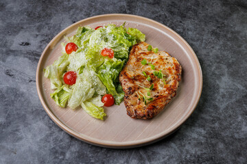 Grilled Chicken and Fresh Romaine Salad on Beige Plate with Cherry Tomatoes - Healthy Dinner Idea