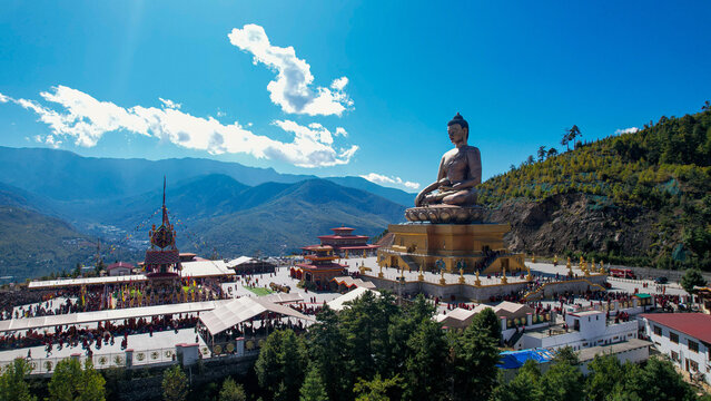 Aerial view of the towering Buddha Dordenma statue and the intricate architecture set against the backdrop of majestic mountains, Thimphu, Thimphu, Bhutan.