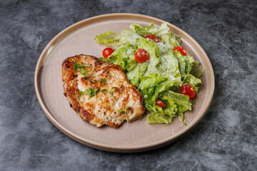 Grilled Chicken and Fresh Romaine Salad on Beige Plate with Cherry Tomatoes - Healthy Dinner Idea