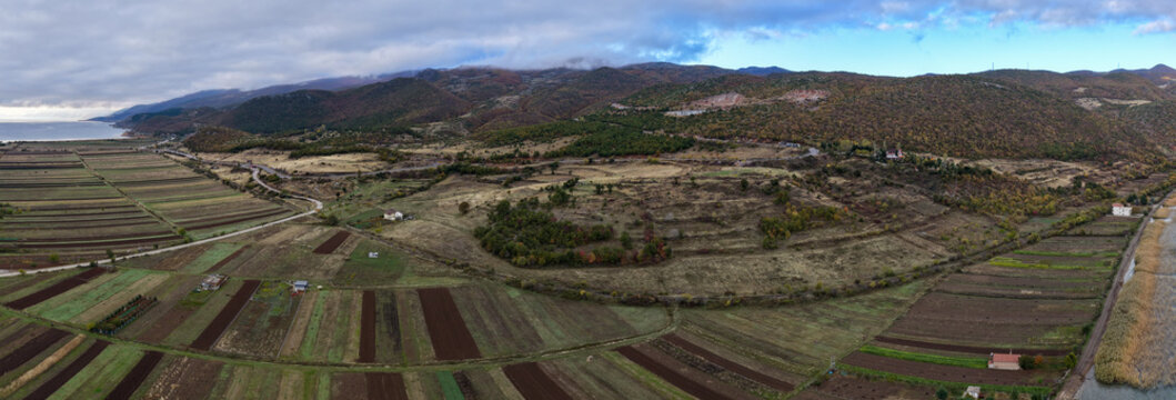Aerial panorama of the farmlands west of Lin, with Qaf&euml; Thane in the distance and North Macedonia on the right side. 