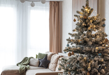 Festive Living Room with Snow-Flocked Christmas Tree and Cozy Decor