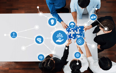 A group of diverse individuals collaborates over a puzzle representing ethics and technology, symbolizing modern justice, responsibility, and innovation in business contexts. Amity