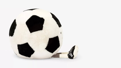 Soft soccer ball character resting on a white surface in a playful and creative arrangement.