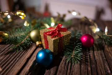Golden Christmas Gift Box with Baubles and Festive Decorations