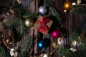 Golden Christmas Gift Box with Baubles and Festive Decorations