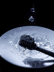 The black toothbrush in the water 
