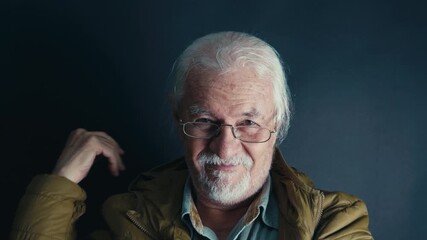 Old Man in Brown Hoodie and Glasses Smiling