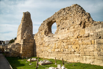 The fortress wall with the tower of the ancient city on a clear sunny day, Chersonesos. Sights of Russia. Architecture of World tourism. © Victor1153
