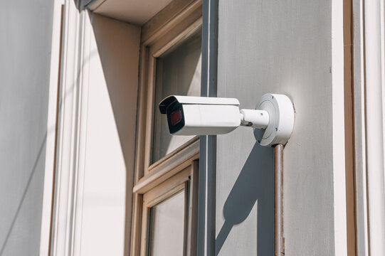 Surveillance camera providing protection and modern security on an outdoor wall, ensuring constant monitoring and safety