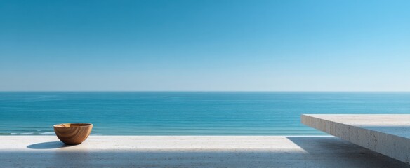 Minimalist coastal serenity with wooden bowl on terrace overlooking sea