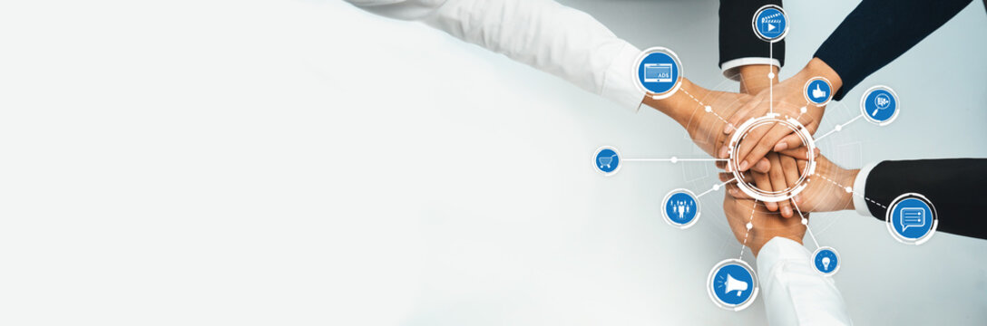 A dynamic image depicting diverse hands joining together in a collaborative manner, symbolizing teamwork and innovation in a modern business environment. Amity - Powered by Adobe