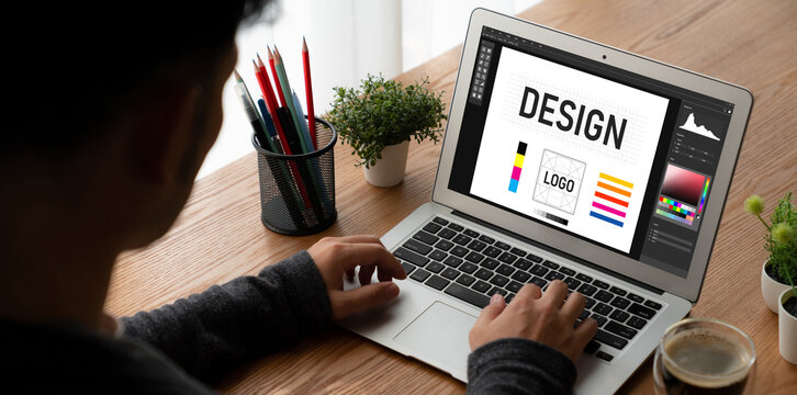 Graphic designer software for modern design of web page and commercial ads showing on the computer screen