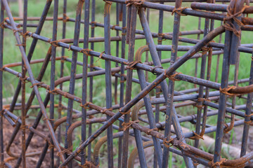 A close-up view of a reinforced concrete footing structure, commonly known as a “cakar ayam”...