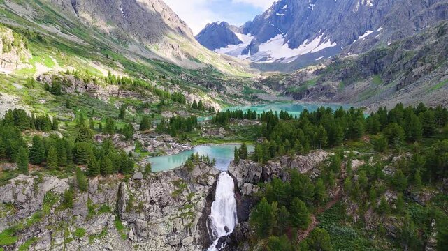Drone flight over the turquoise-colored mountain lake of Kuyguk in the Altai Mountains