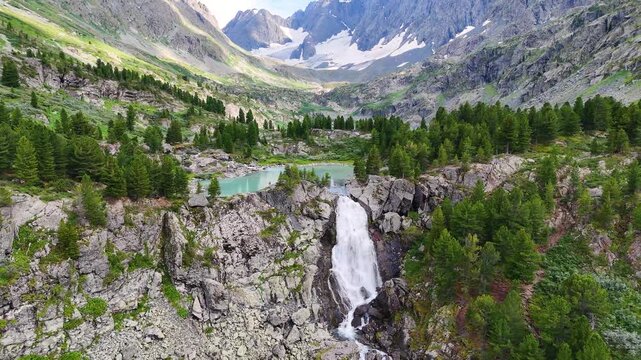 Drone flight over the turquoise-colored mountain lake of Kuyguk in the Altai Mountains