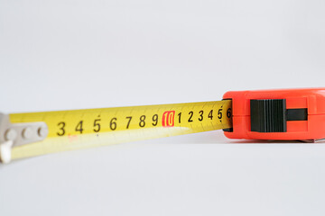 Measuring device. Meter. A working tool on a white background. Repair and construction