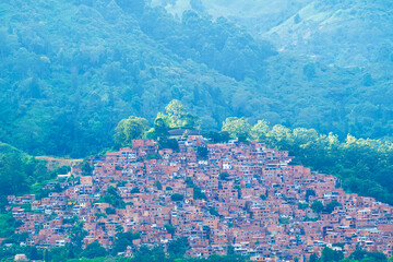 One Favela of the district of Bel&eacute;n surrounded by forest on a hill.