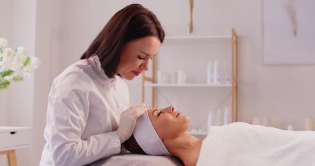 Cosmetologist spa beautician doing face massage female skin care using beauty treatments, perfect healthy appearance, wellness beauty salon dermatologists professional service for feeling rejuvenated