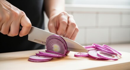 Caucasian adult female slicing red onion in kitchen setting