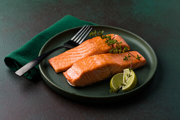 Cooked salmon fllets on green background