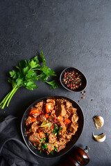 Goulash (meat stew with tomatoes and paprika) - traditional dish of hungarian cuisine .Top view with copy space.