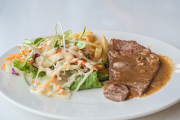 Close up of Grilled beef steak, boiled french fries and vegetable salad;Selective focus