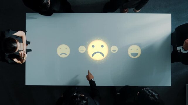 A top view of a modern conference table featuring emoticons displayed as projections, highlighting communication and engagement during a business meeting. Raster