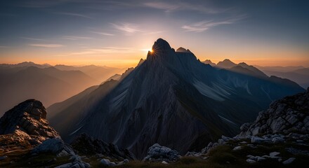 Stunning mountain range sunrise with golden light piercing the peak, promising adventure and escape in a breathtaking landscape vista