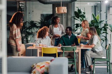 Diverse business team collaborating in modern office meeting