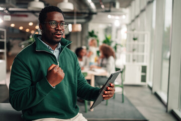 Black businessman discussing project, video calling with tablet