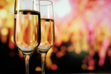 intimate dinner with sparkling fireworks, elegant champagne toast amidst soft glowing lights