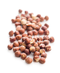 Peeled hazelnut kernels isolated on white background.