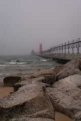 Breakwater on a foogy morning.  South Pierhead, Grand Haven, Michigan, USA.