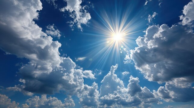 Bright sun shines through puffy white cumulus clouds in blue sky on a summer day, representing possibilities in the stock market