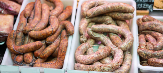 Fresh Catalan butifarra sausages made with spiced and pork. Traditional meat product of Spanish cuisine, popular in Catalonia.