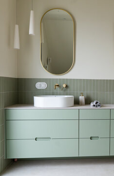 Modern Bathroom Vanity with Gold Mirror and Sage Green Cabinets