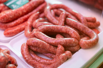 Fresh Catalan butifarra sausages made with spiced and pork. Traditional meat product of Spanish cuisine, popular in Catalonia.