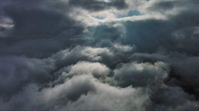 Aerial high view of dramatic clouds and sun
